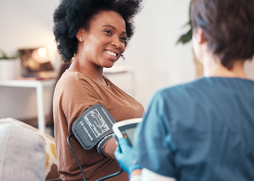 A patient has her blood pressure checked