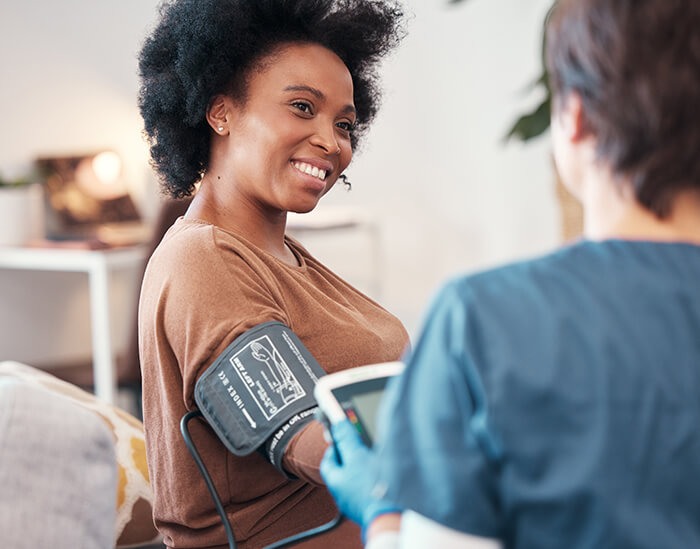 Patient having blood pressure taken.